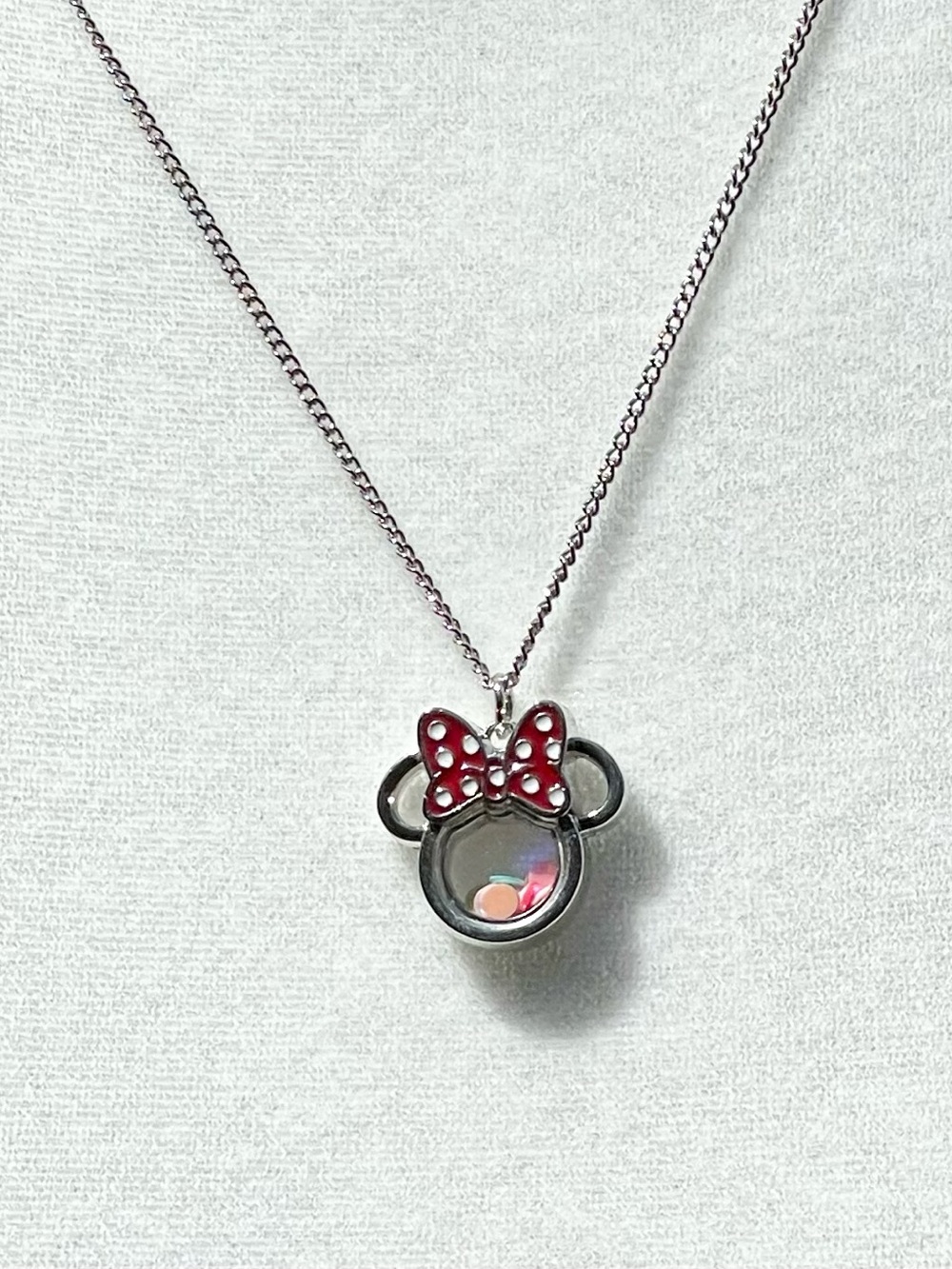 Minnie Mouse shaker charm on silver chain.